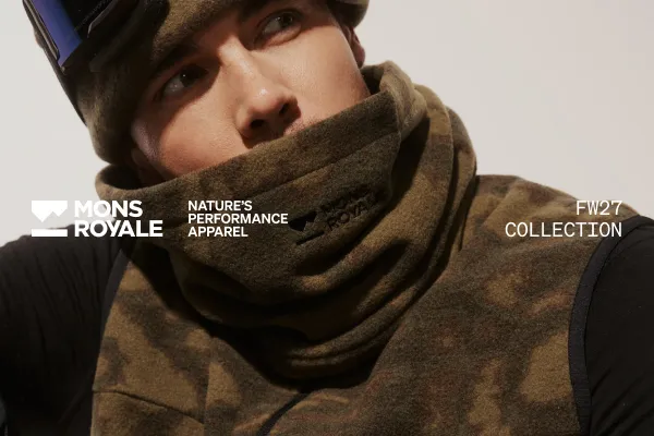 Model in a brown camouflage neck warmer and cap for the Mons Royale FW27 collection.