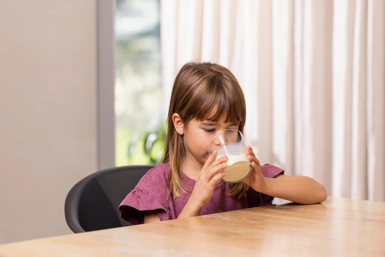 Young Girl Drinking Milk