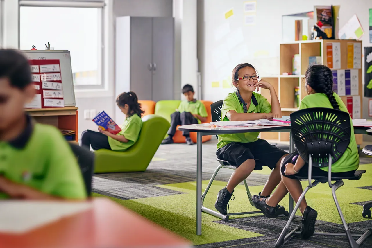 New Zealand primary school children learning together in a modern classroom