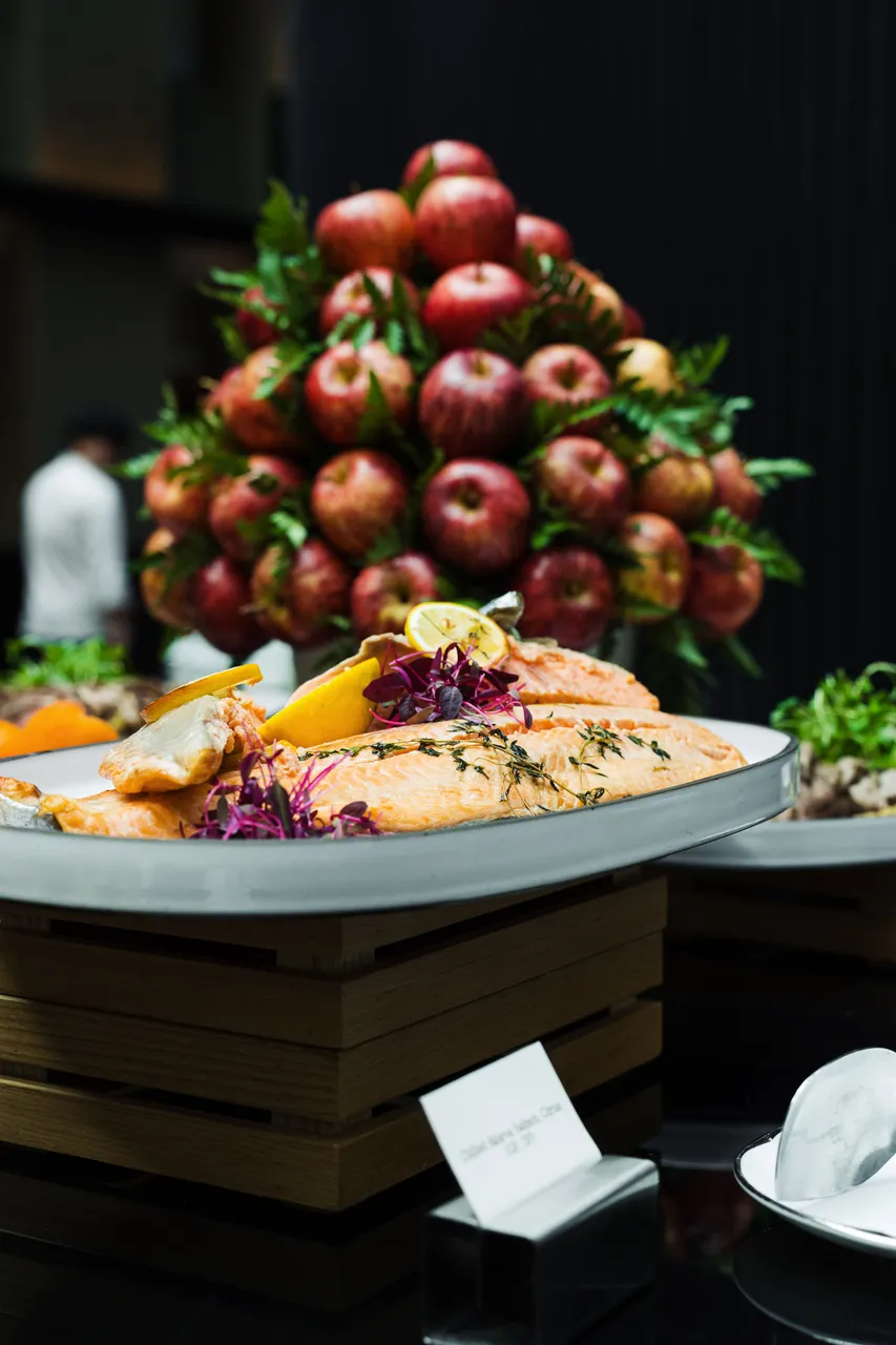 Plated salmon with lemon and apples