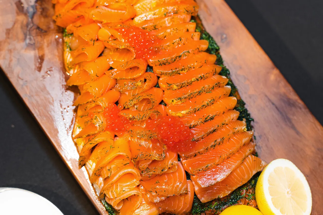 Plated salmon with lemon and fish roe