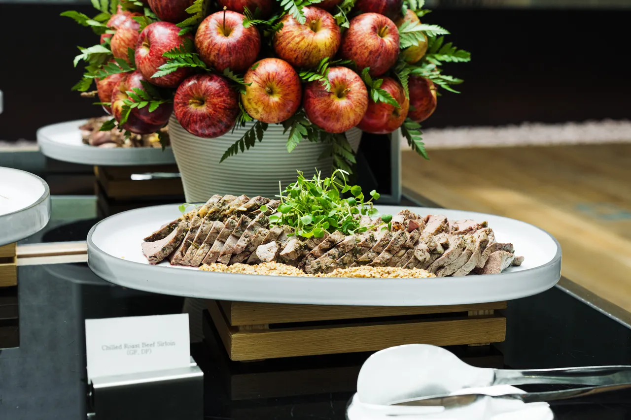 Sliced beef with stacked apples