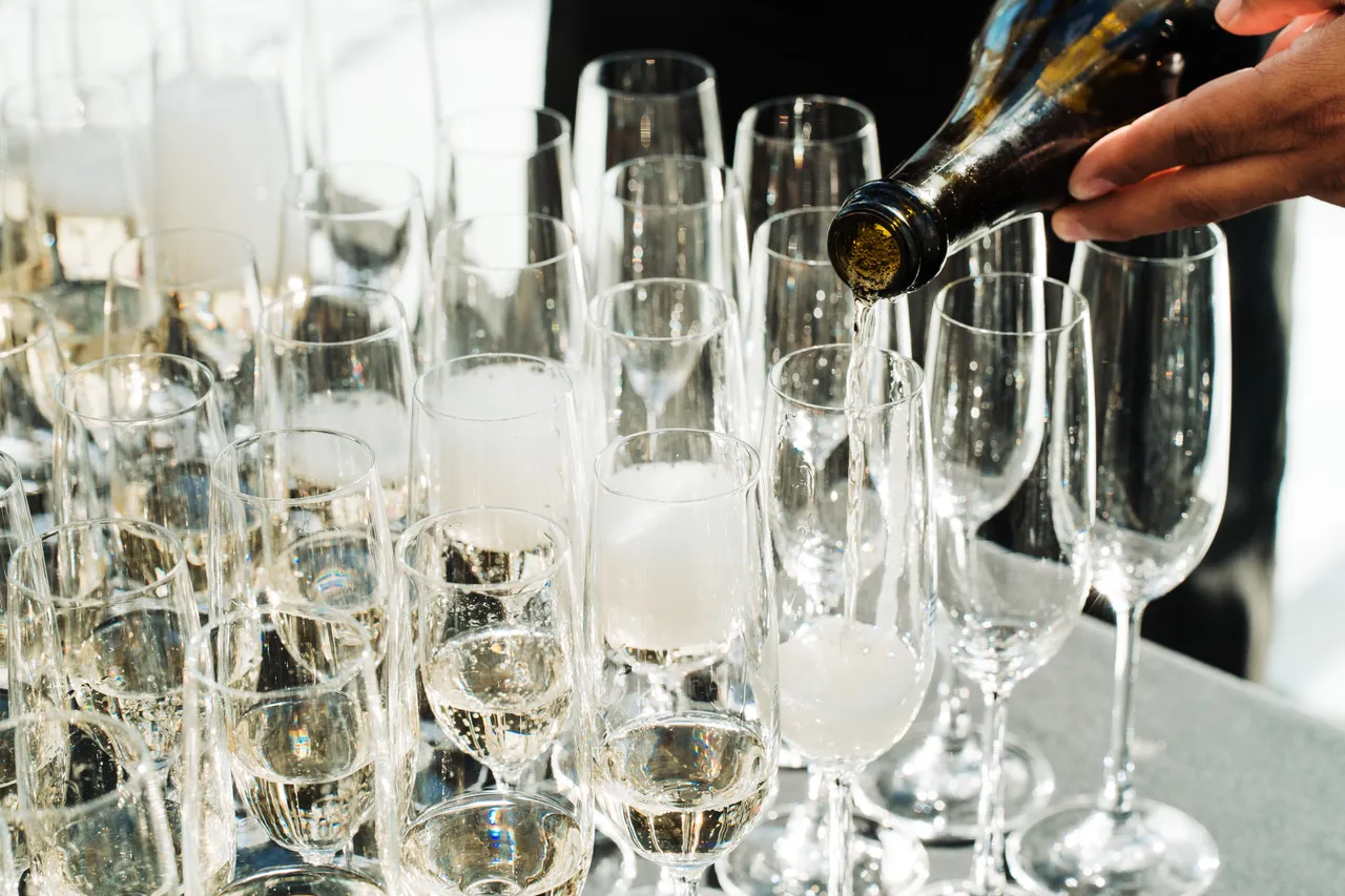 Pouring champagne into glasses