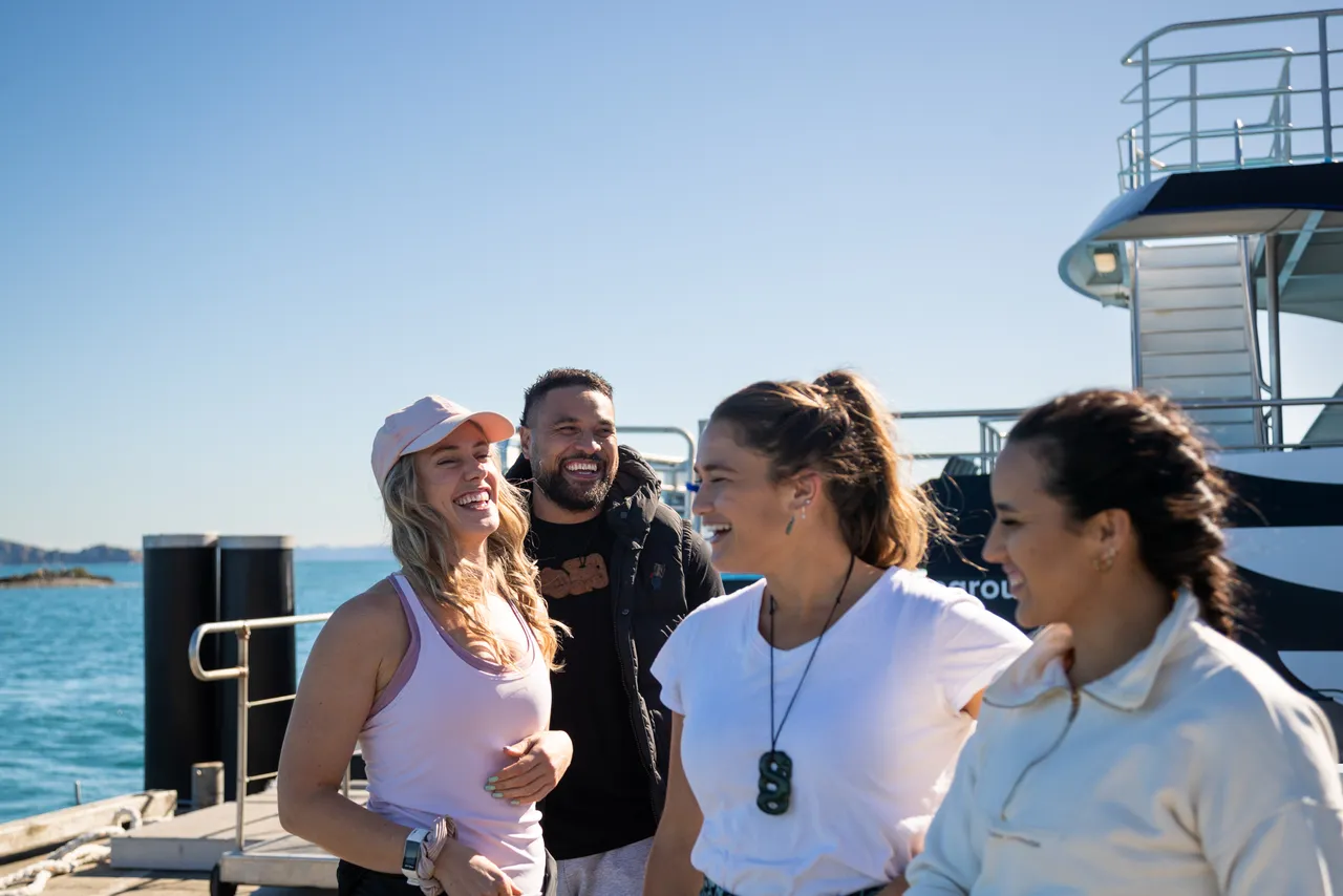 ApparelClothingHumanPersonShortsUndershirtLandscapeimageNo LicenseNo Brand Group on the wharf at Tiritiri Matangi island