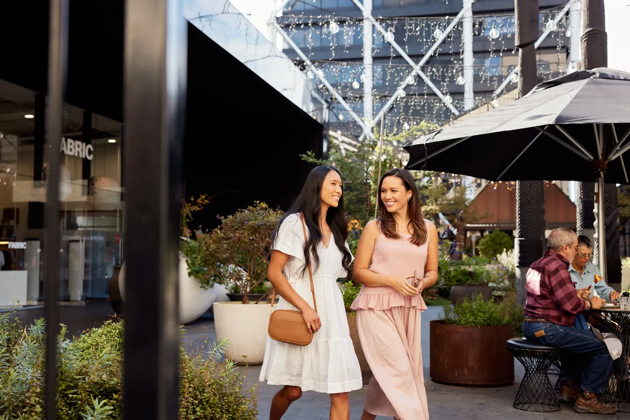 Smiling women walk around Britomart
