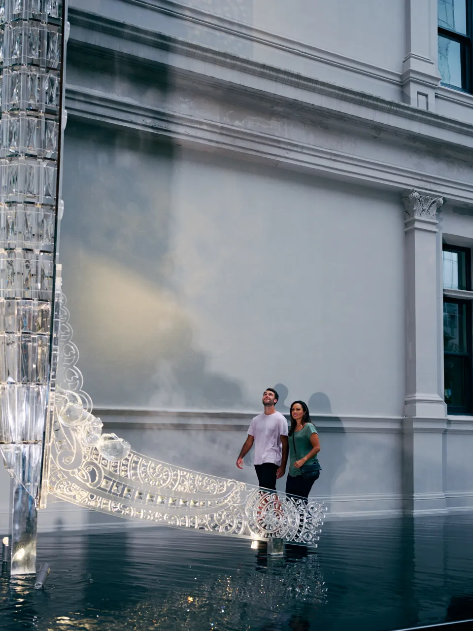 Man and woman admire Crystal Waka sculpture