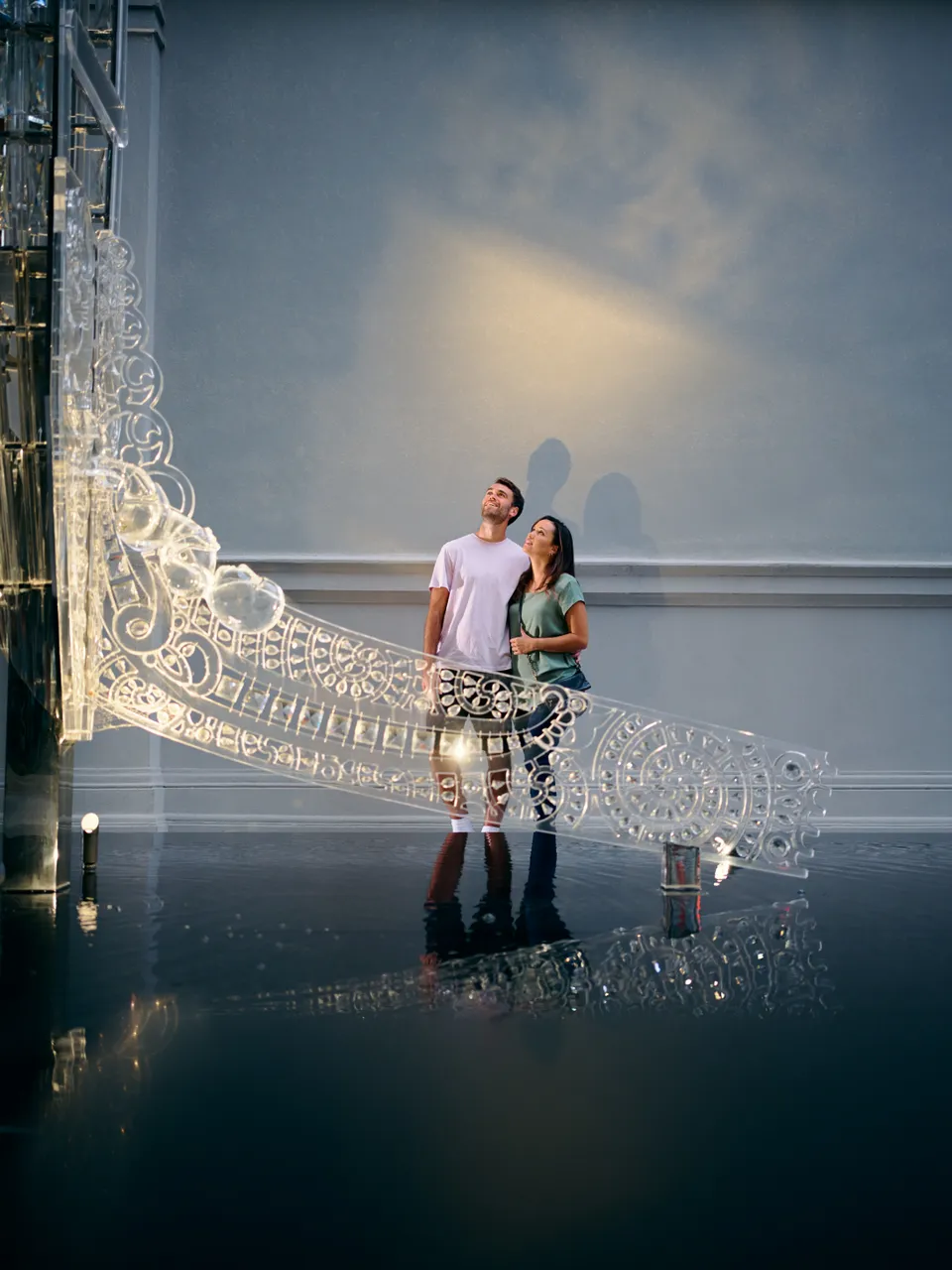 Couple gaze at Crystal Waka sculpture