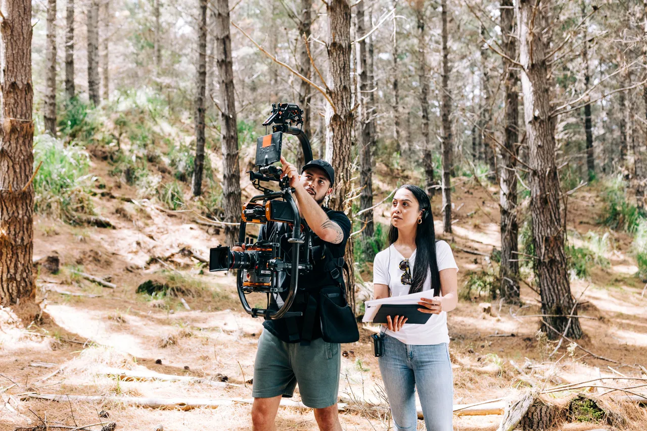 Cameraman shows the director what he is filming