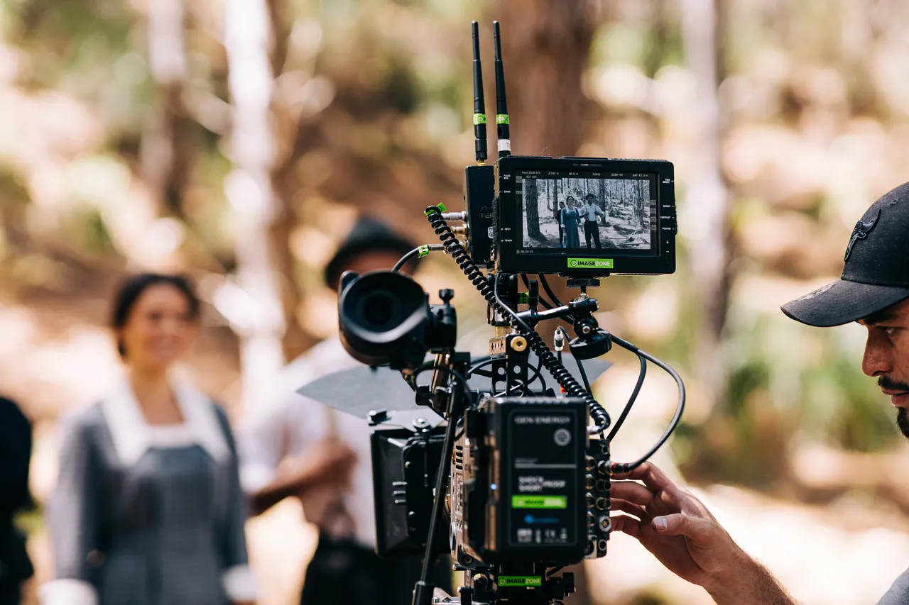 Close up of camera filming actress and actor