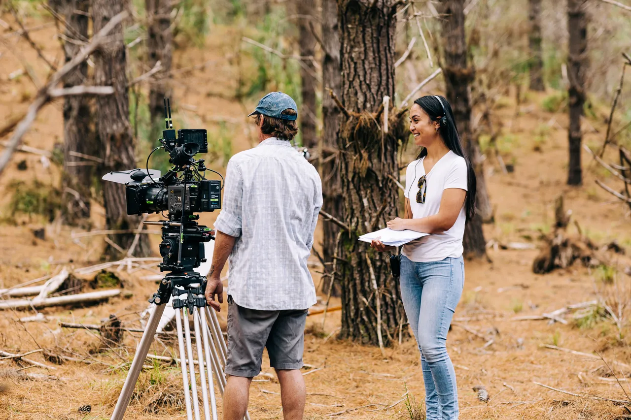 Behind the scenes image of cinematographer and director on set