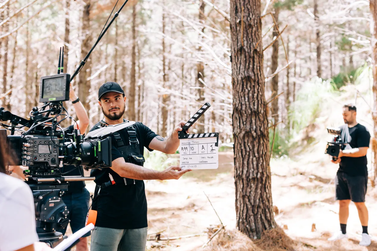 Camera Assistant using clapper board in front of the camera