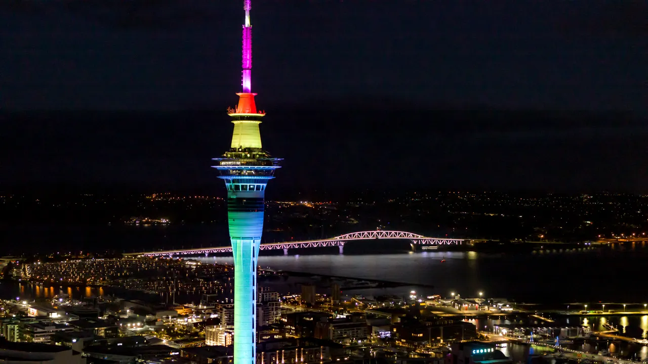Sky Tower lit up rainbow coloured