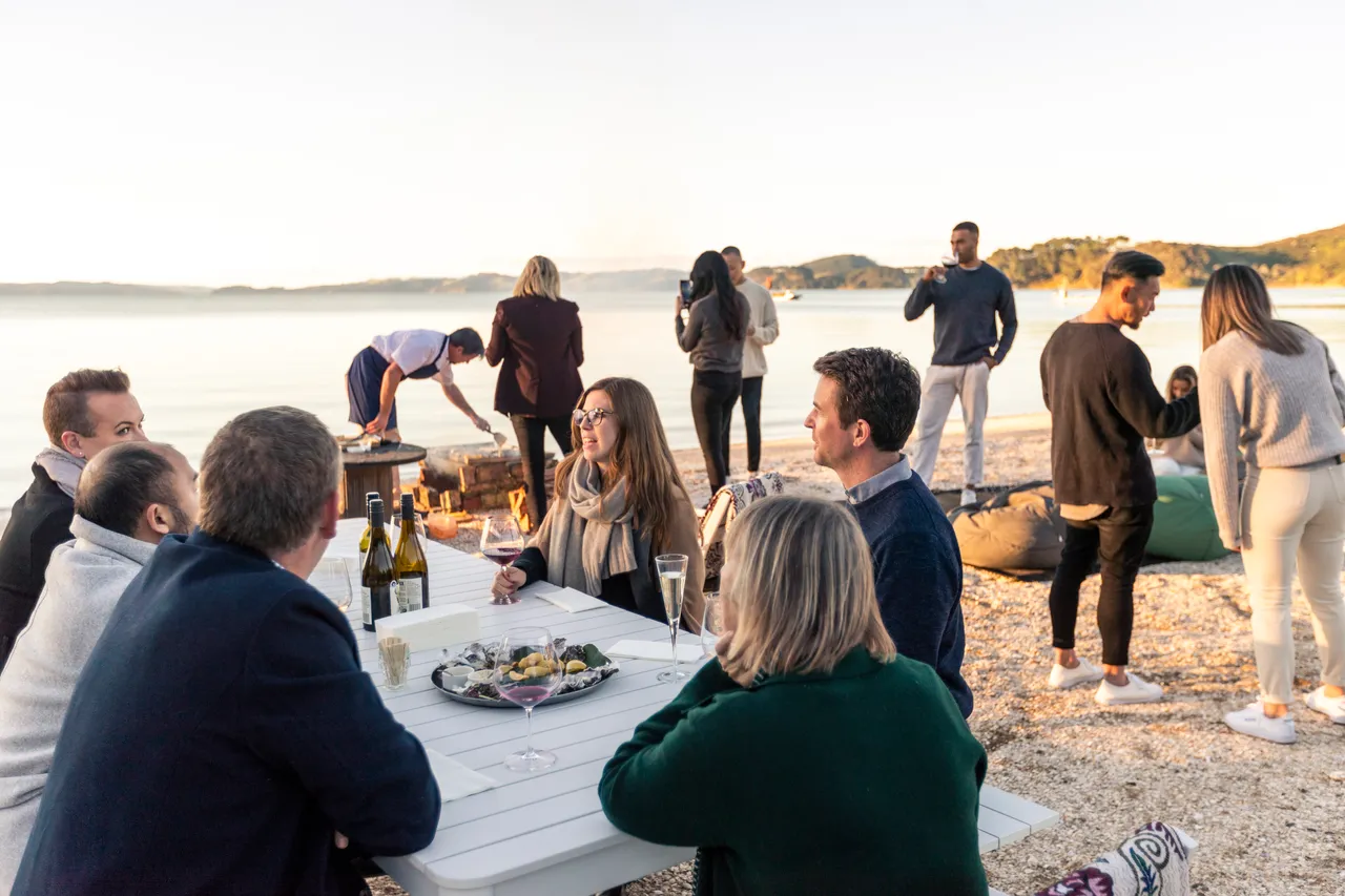 Delegates having dinner on beach