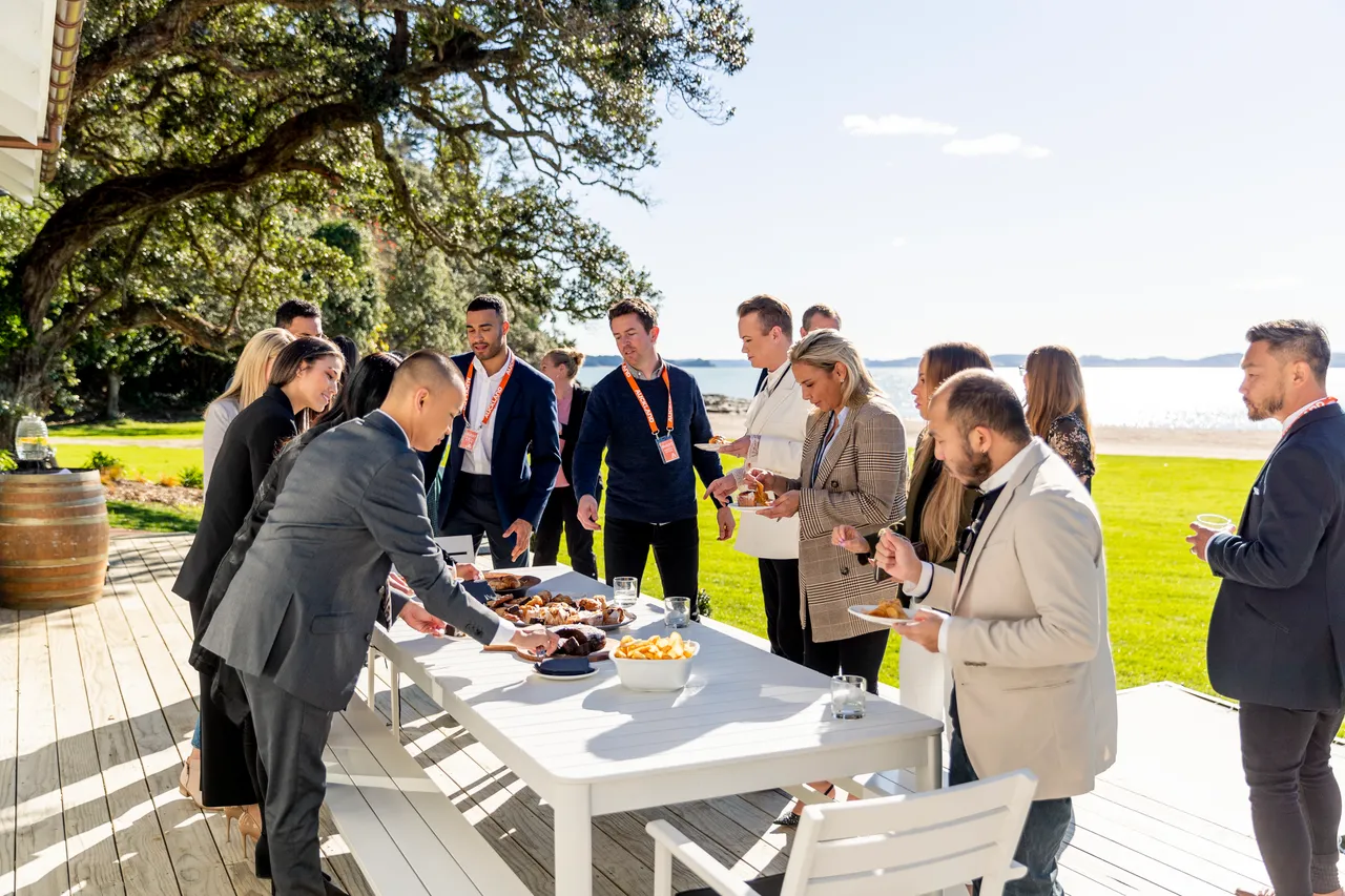 Delegates enjoying the outside food platter