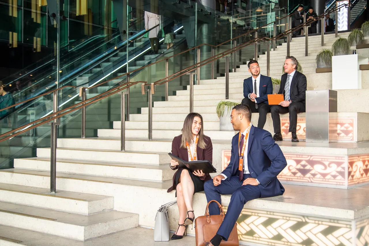 Delegates have meeting on stairs