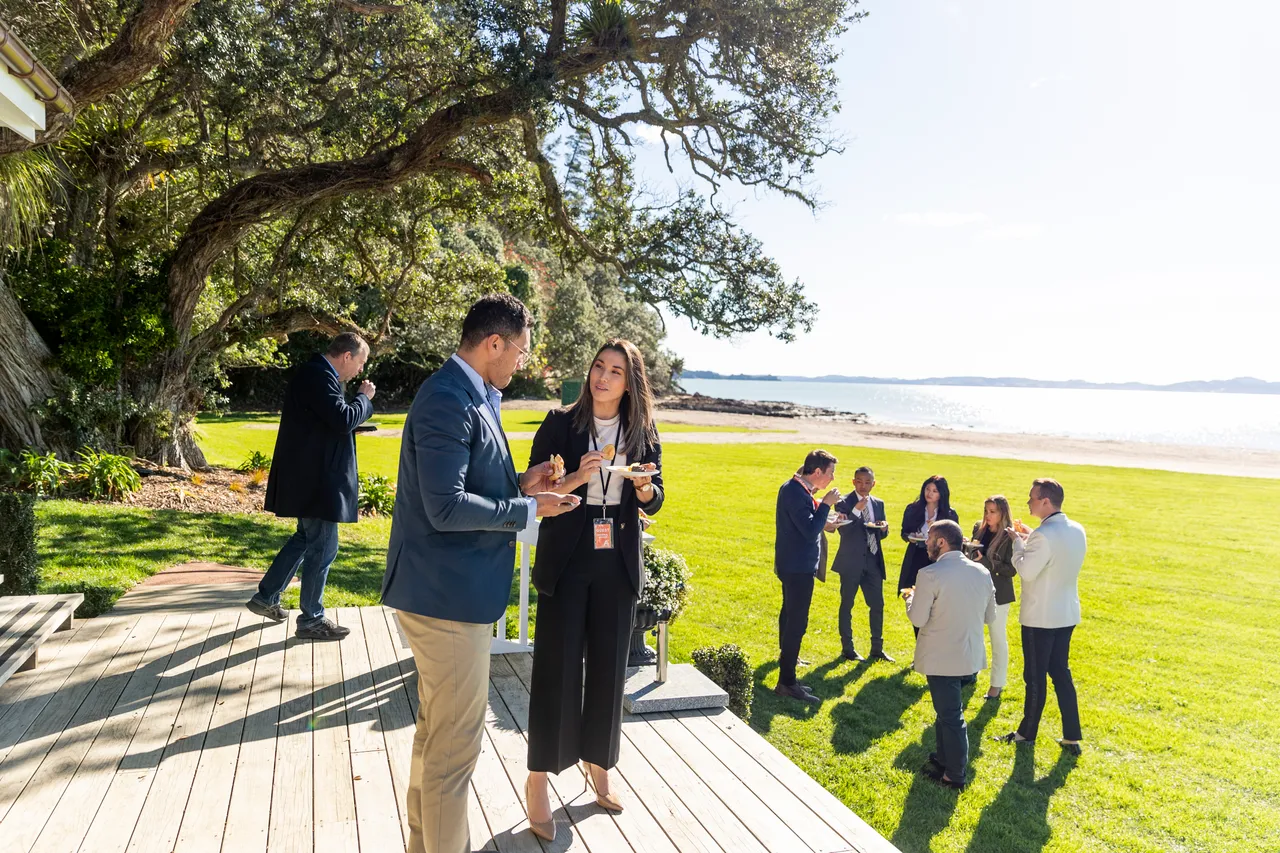 Delegates enjoying a snack in the sunshine