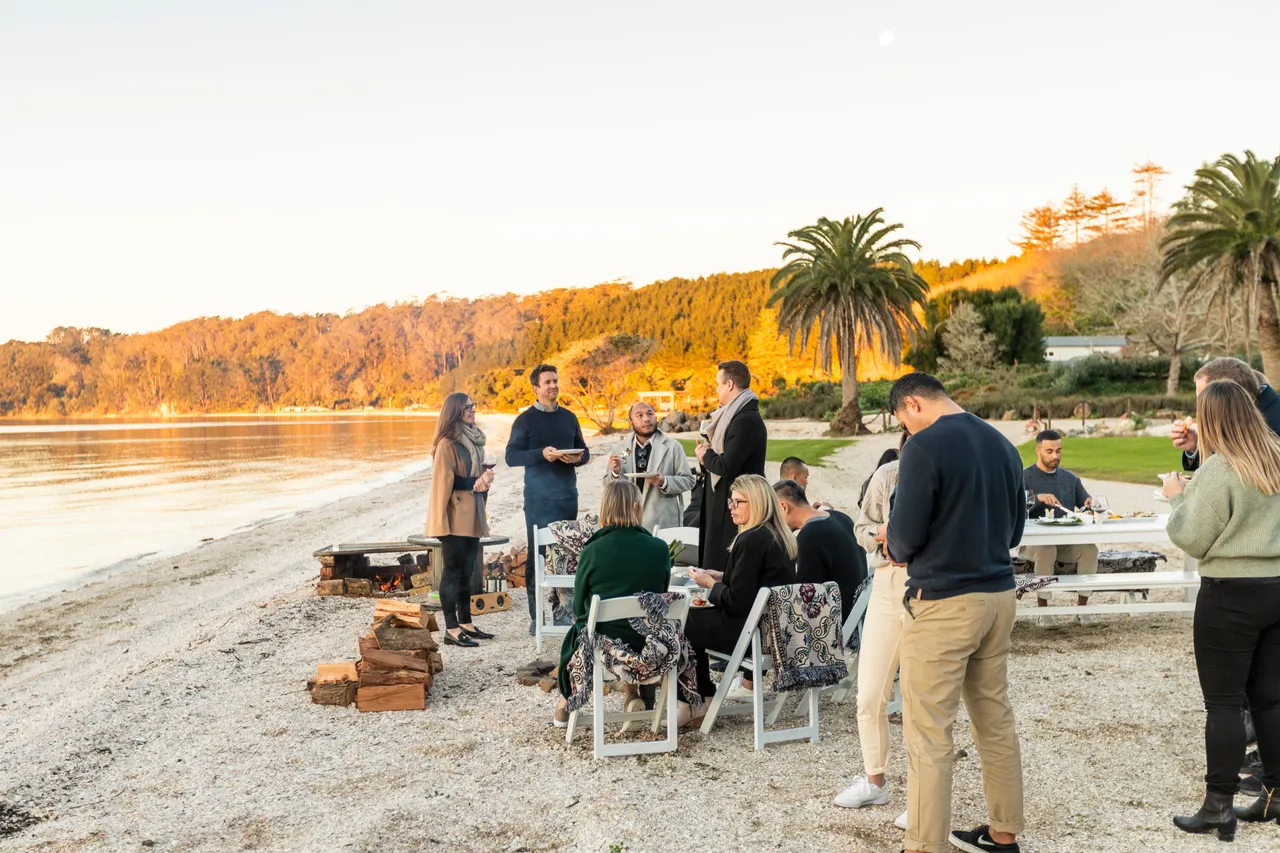 Delegates enjoying food on beach