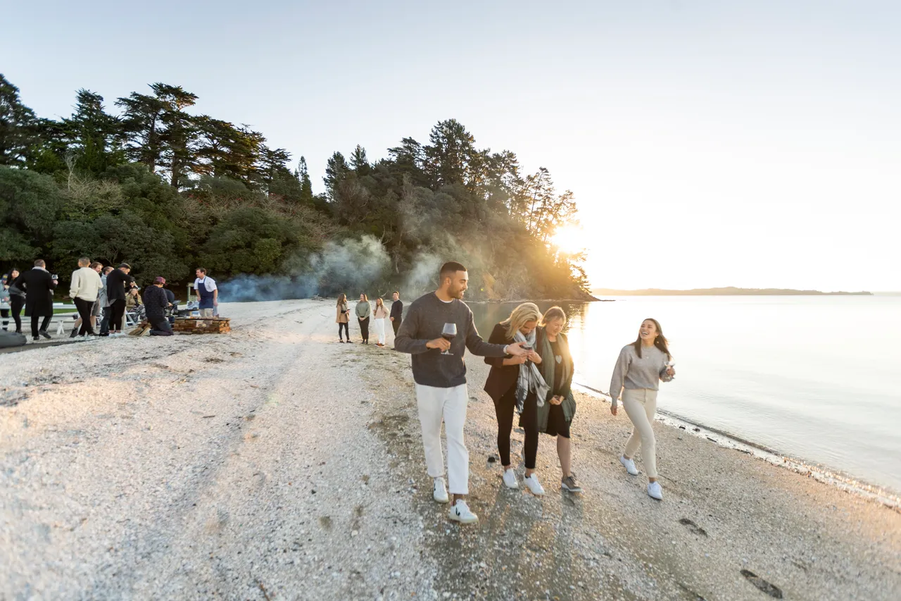 Delegates enjoy a walk along beach