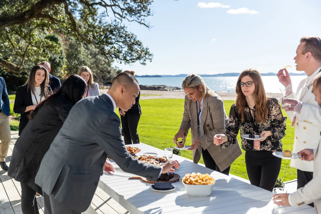 Delegates enjoying food in the sunshine