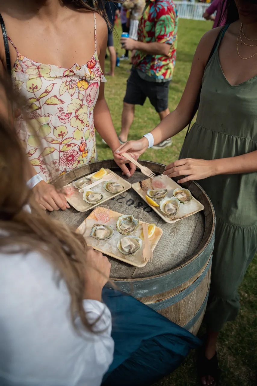 Women enjoying Bluff oysters