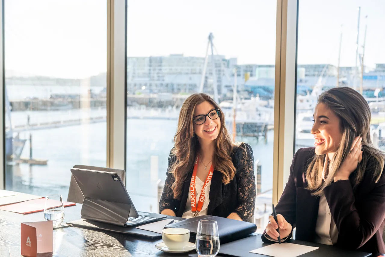 Two female delegates in meeting