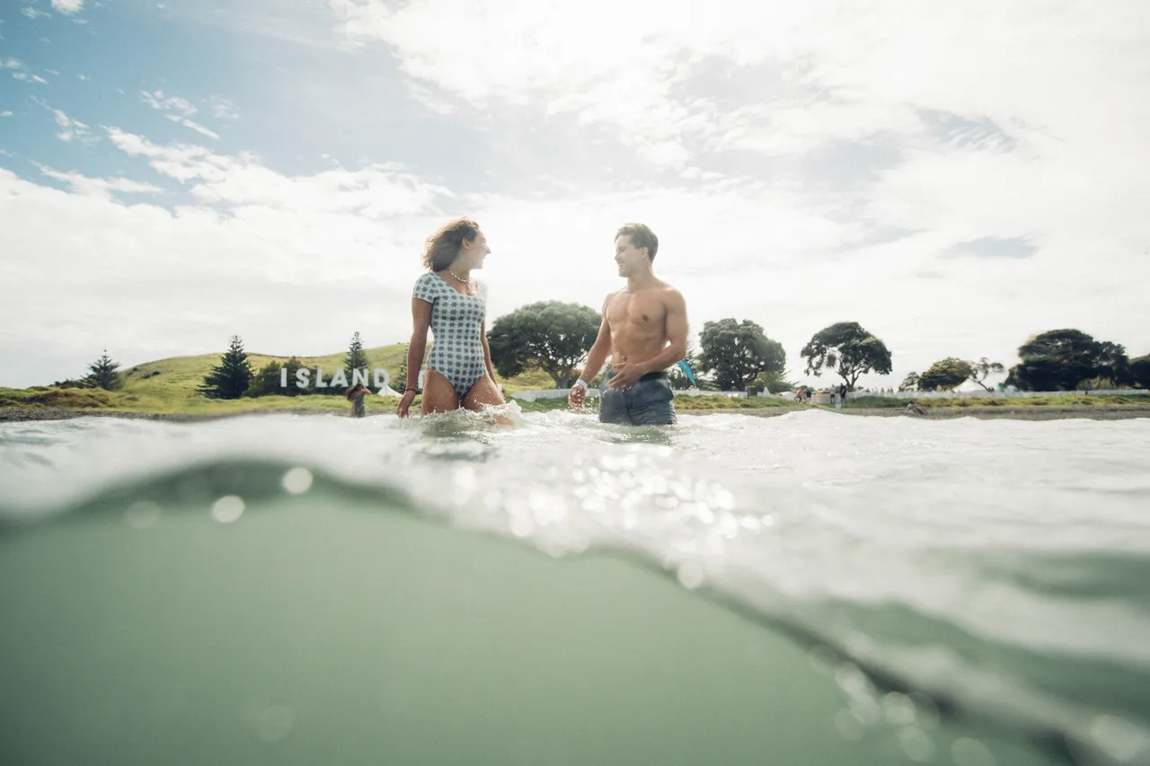 Man and woman taking a dip at festival
