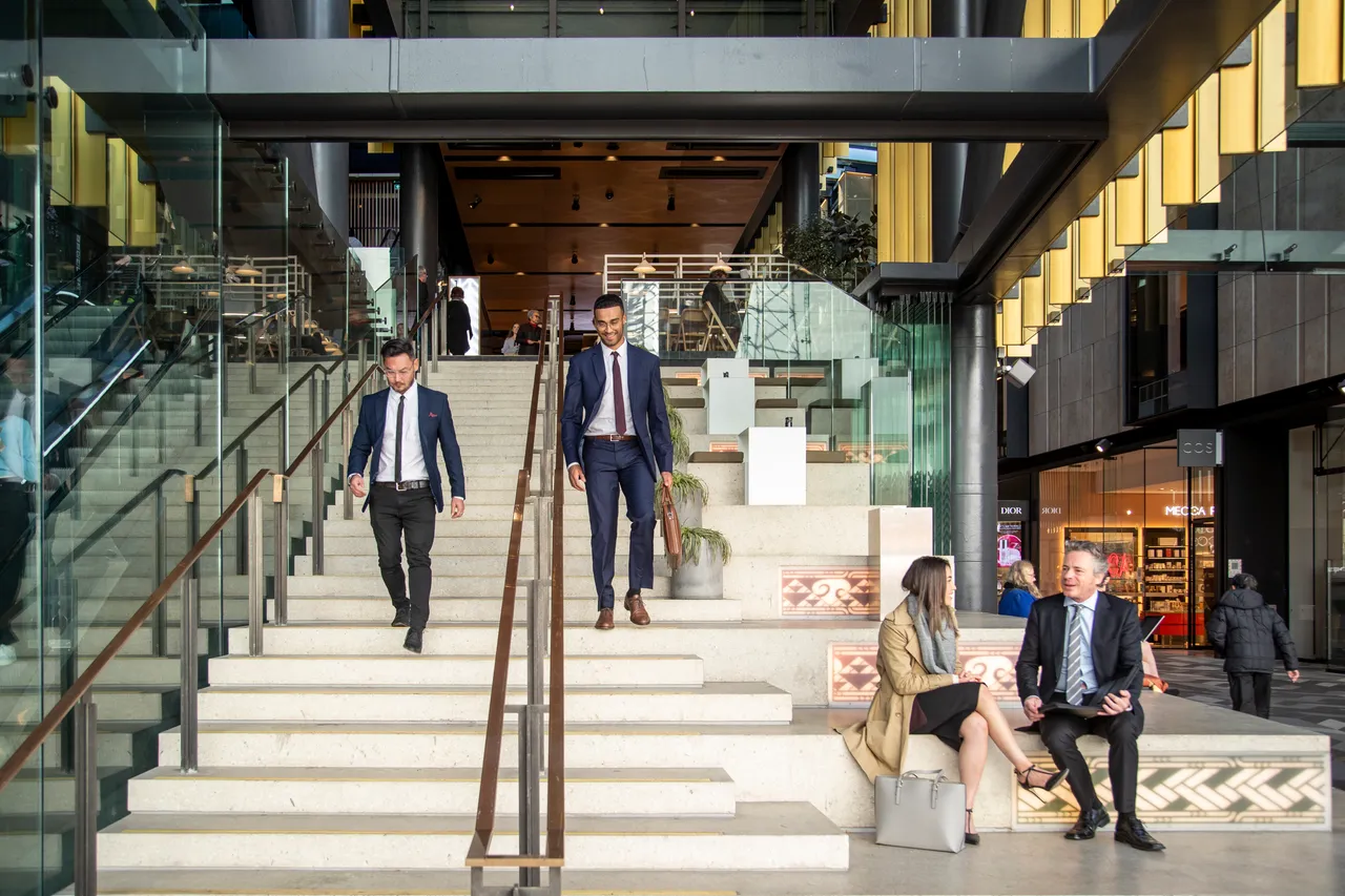 Delegates walking down stairs