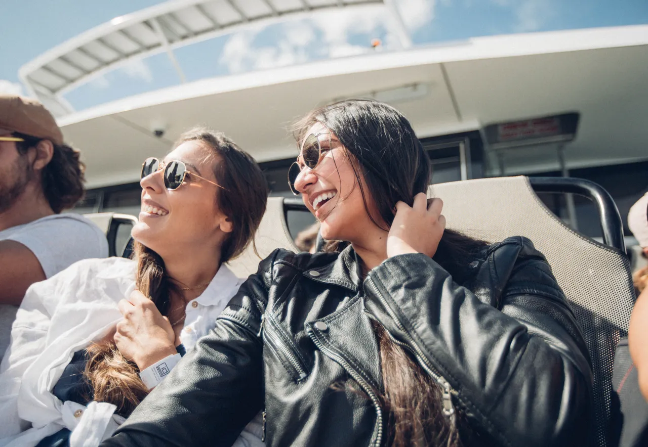 Two ladies smiling on a boat