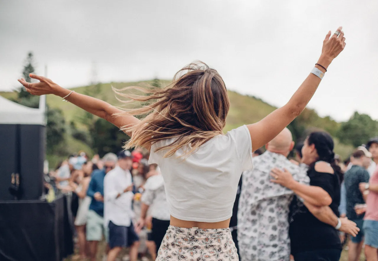 Festival-goer dancing in crowd
