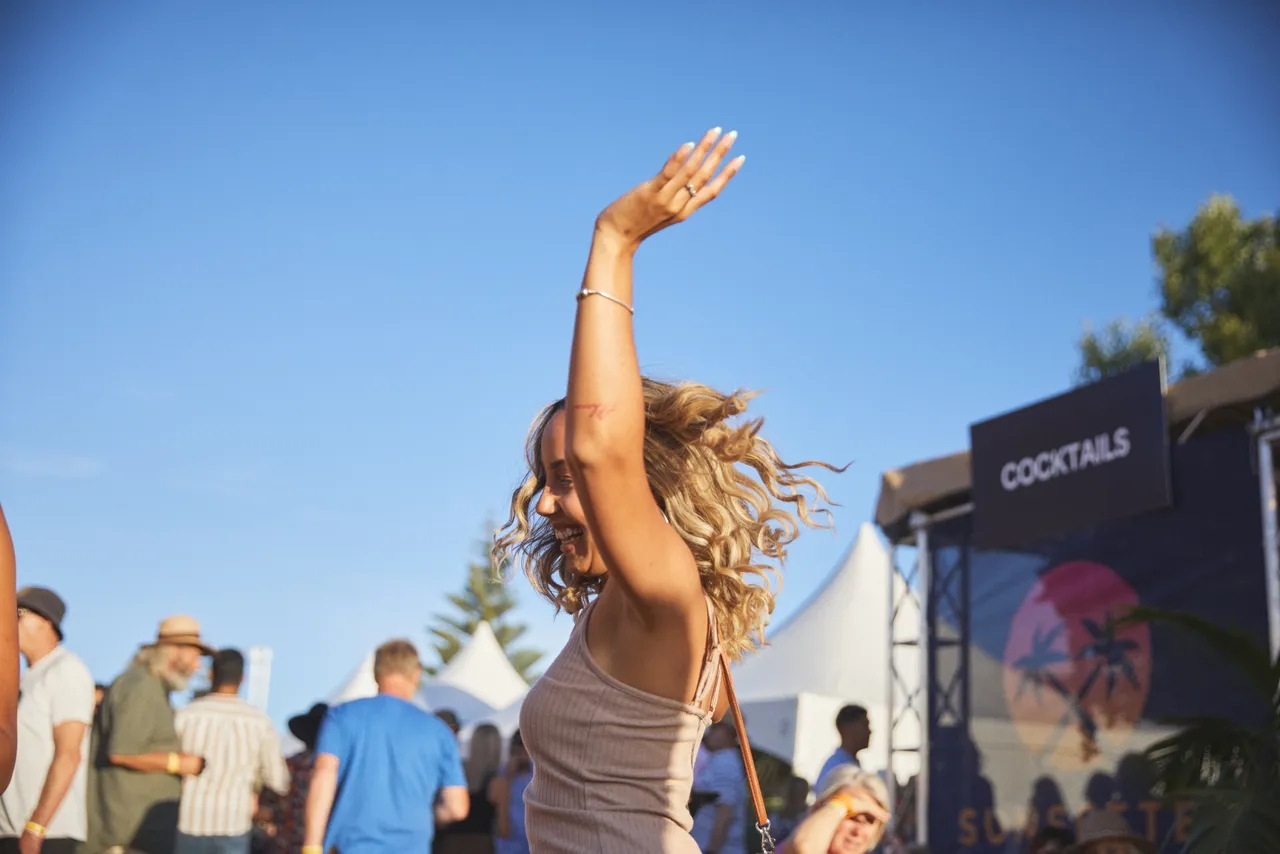 Woman dancing amongst the crowd