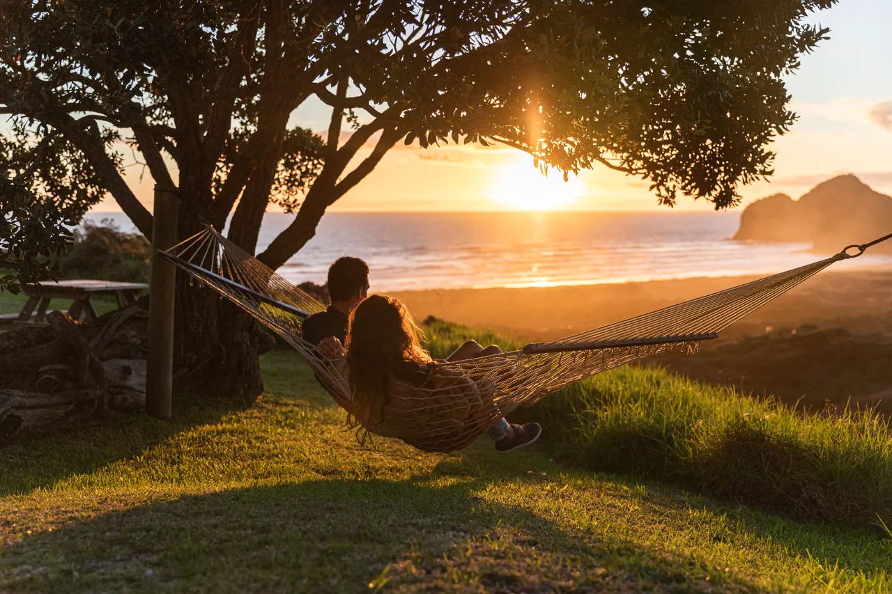 Couple in a hammock by the beach