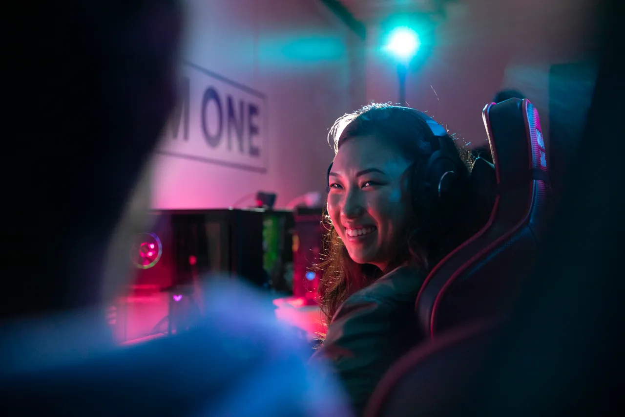 Young woman with heapdhones smiling