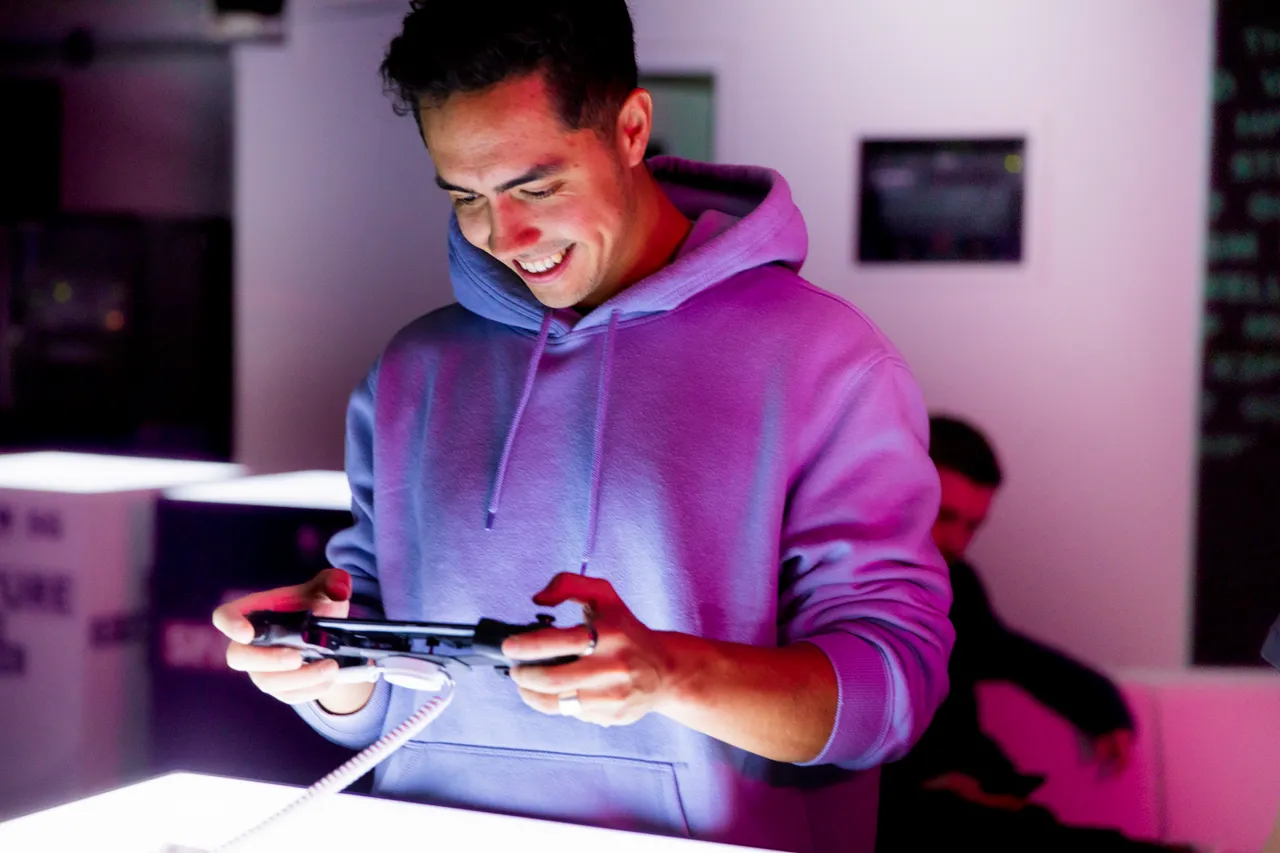 Young man playing games on mobile phone
