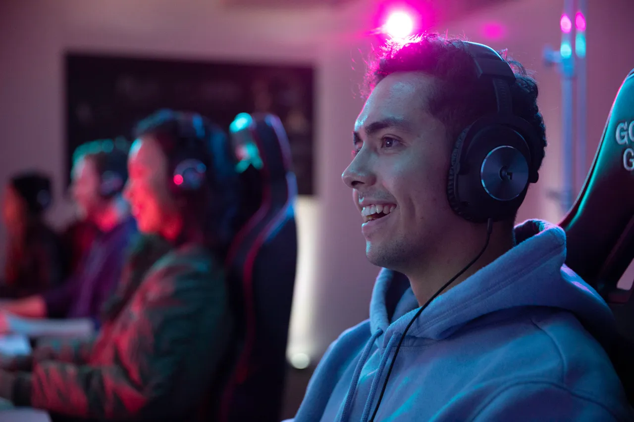 Young man with headphones smiling