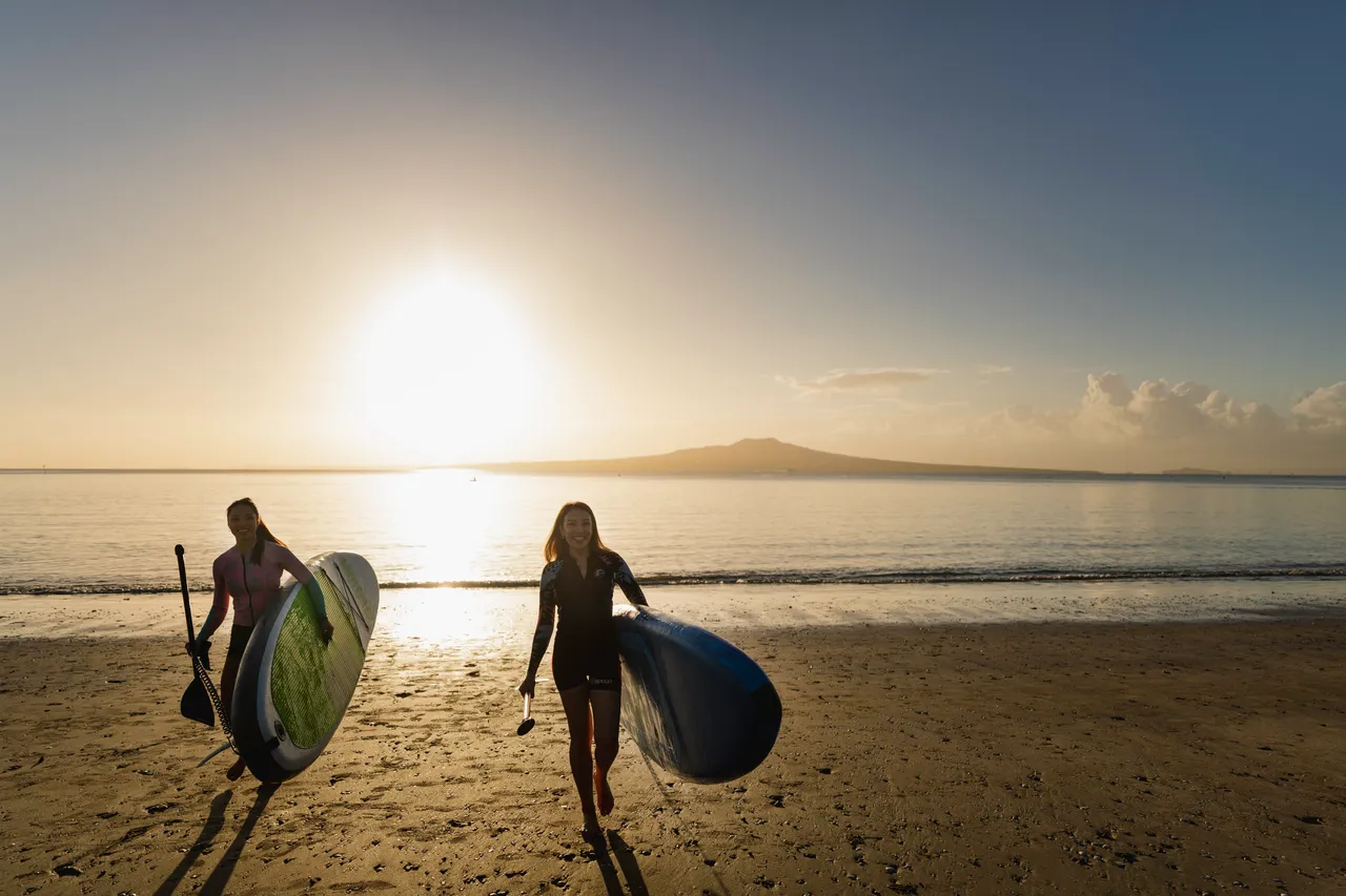 Women paddle boarding in Auckland