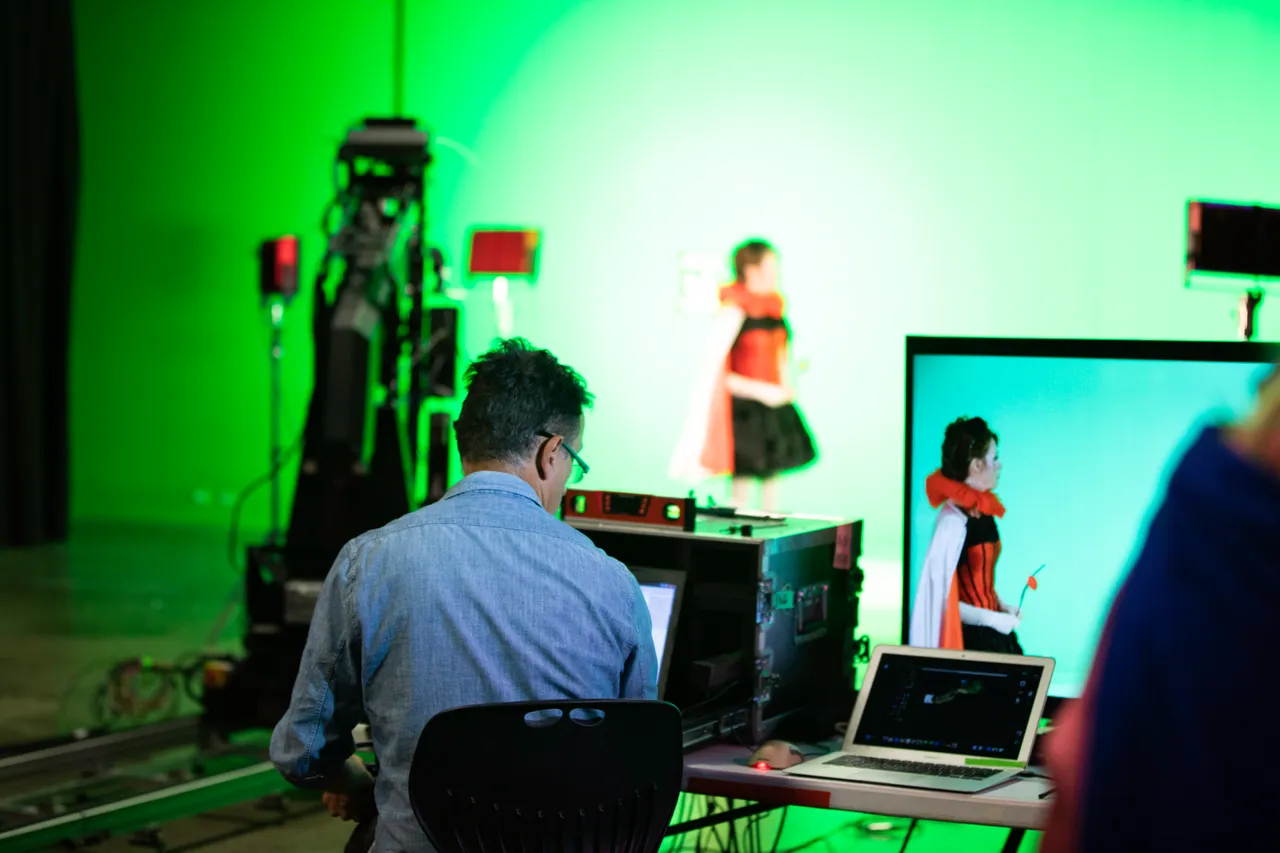 Green screen studio with crew and equipment