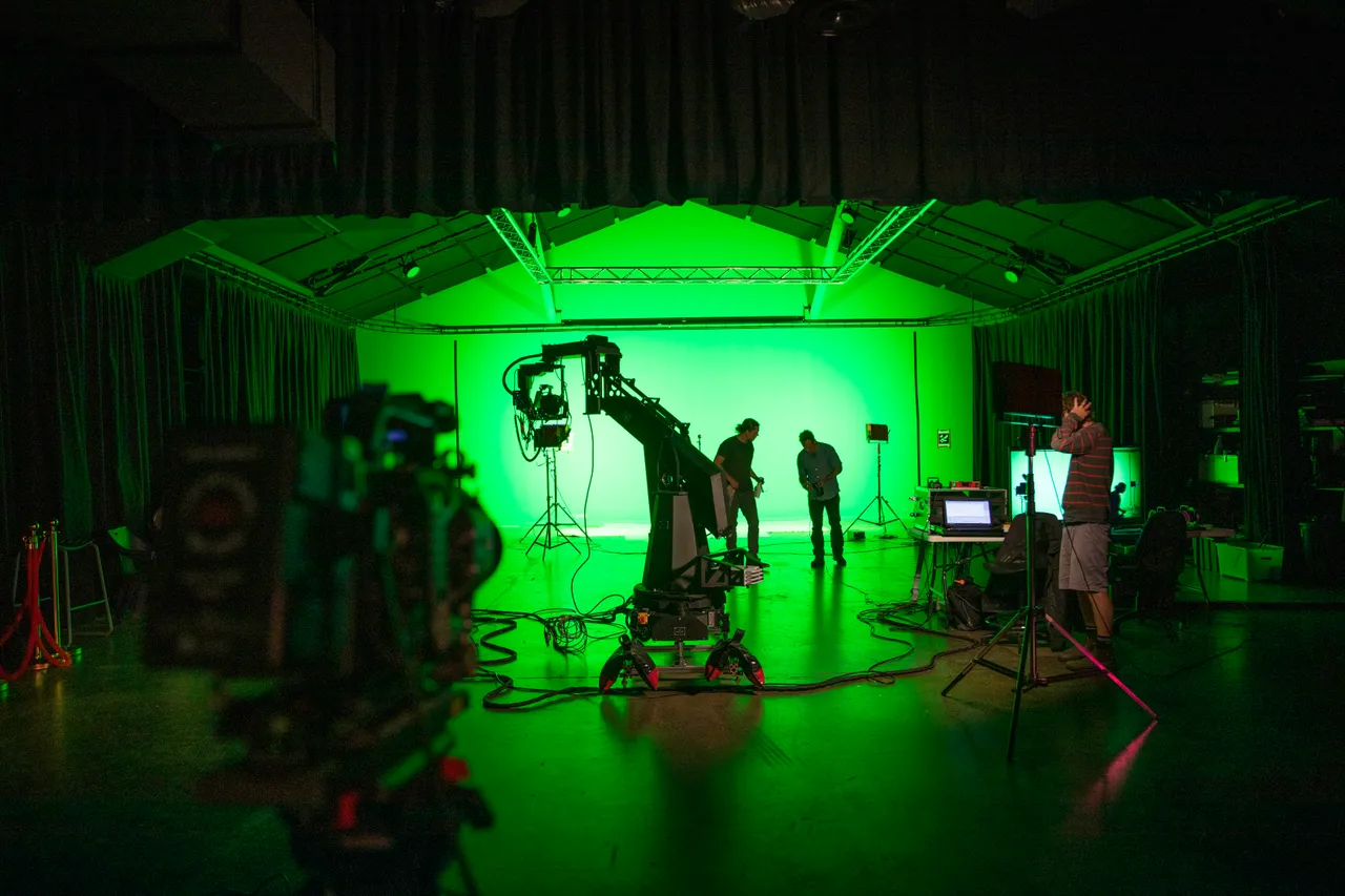 Green screen studio with camera equipment