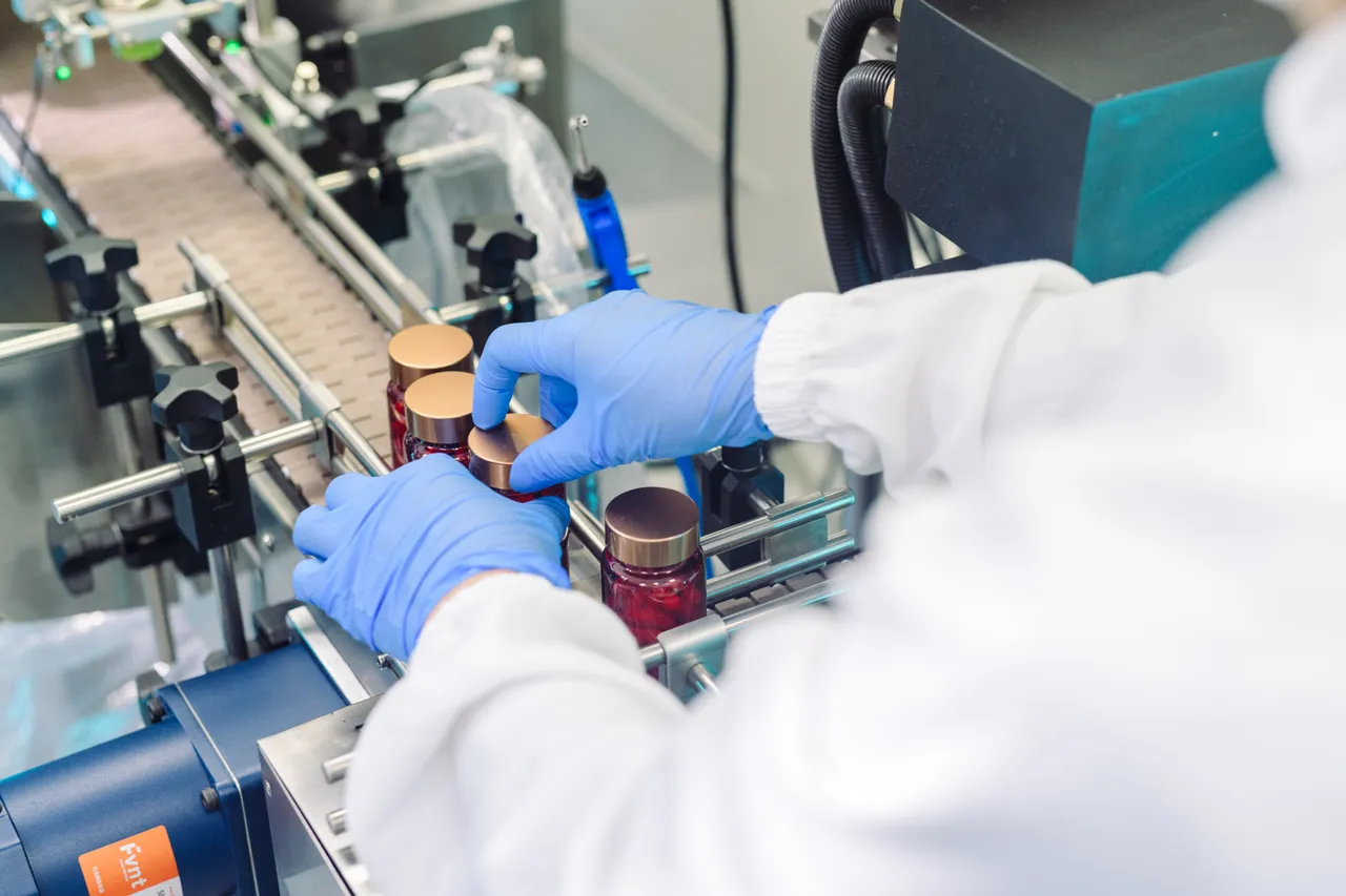 Person handling product on production line
