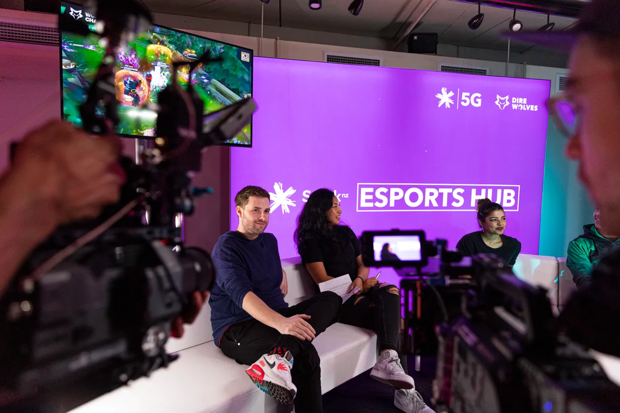 Group of people in front of cameras at Spark NZ Esports Hub