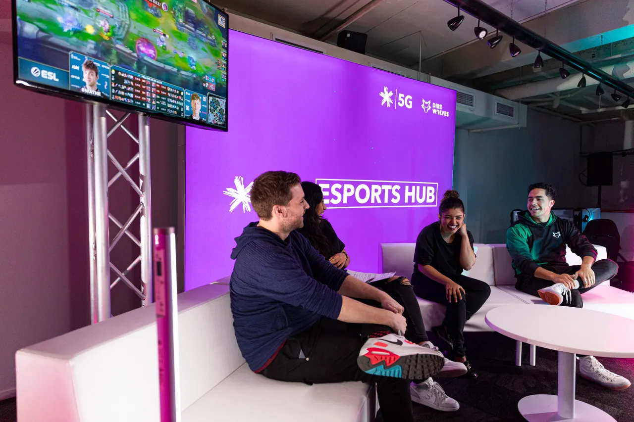 Group of people sitting on couches at the Spark NZ Esports Hub