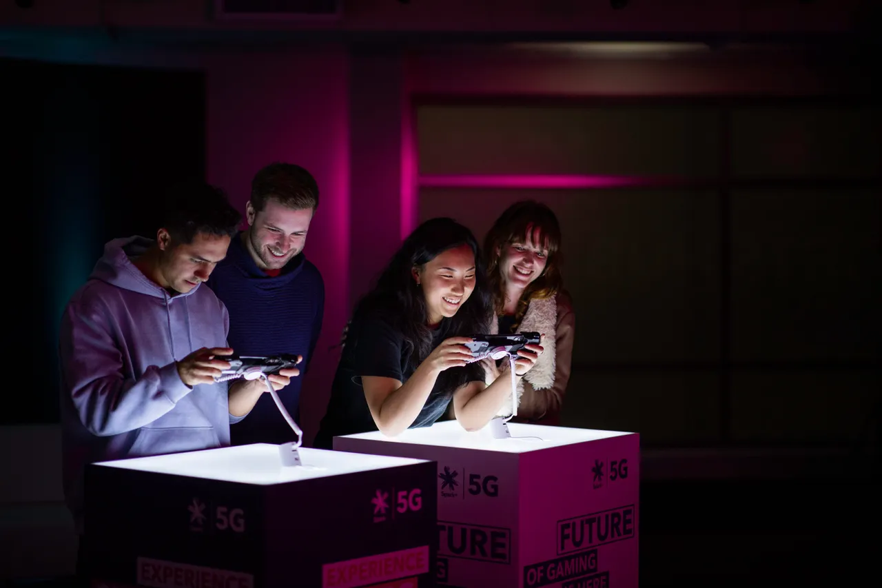 A group of young people playing games on mobile phones