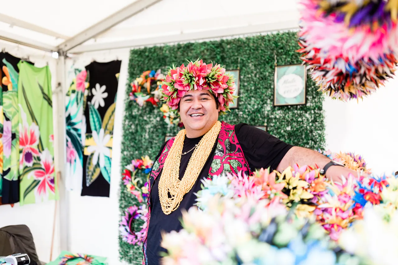 Smiling man with head ei at market