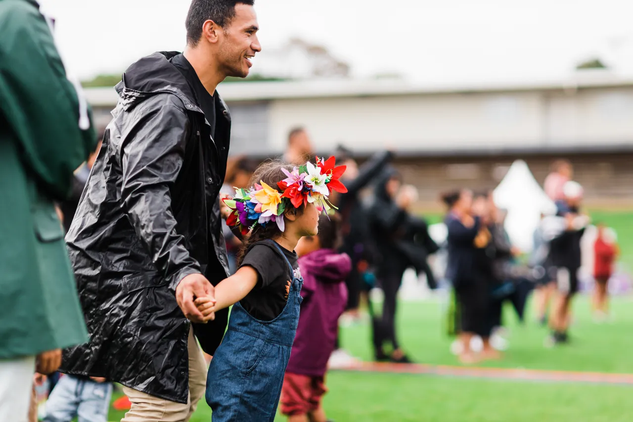 Man and child with head ei dancing