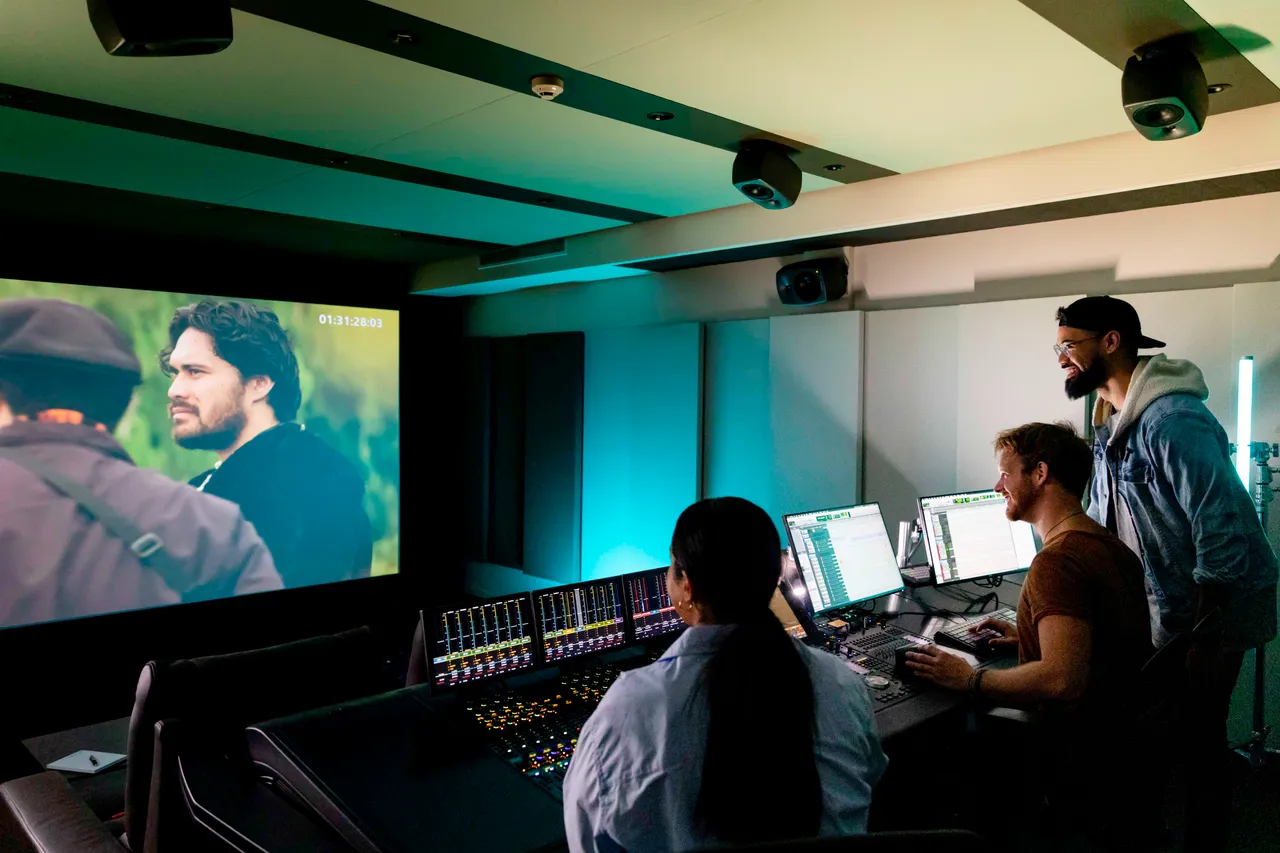 Group working in editing studio