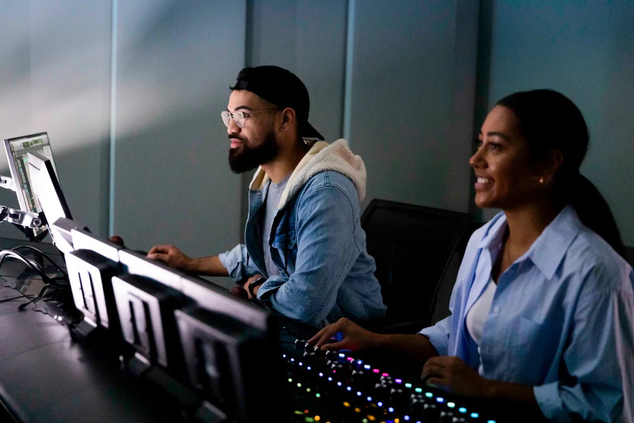 Man and woman working in editing studio