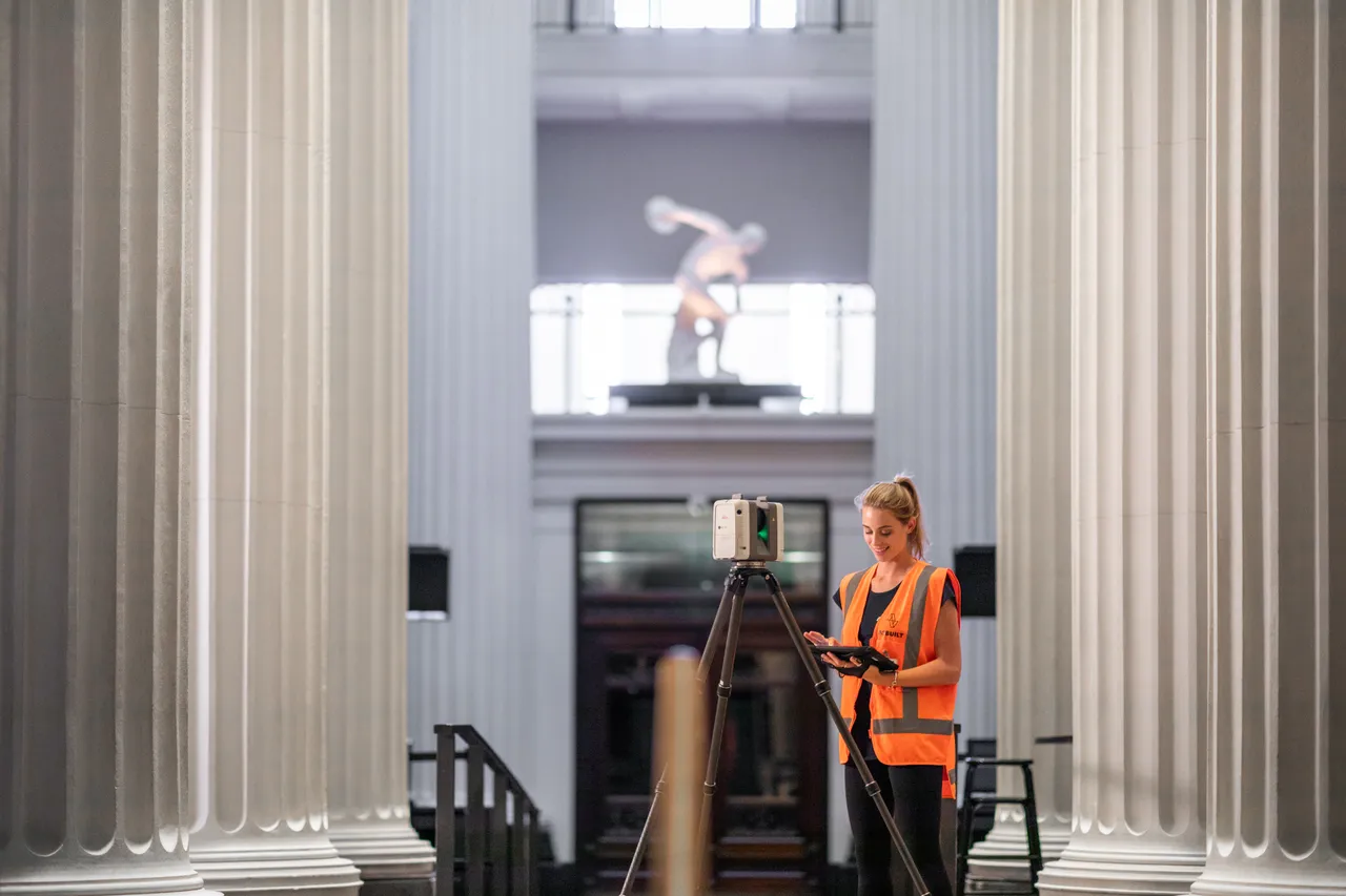 Woman working with scanner inside the museum