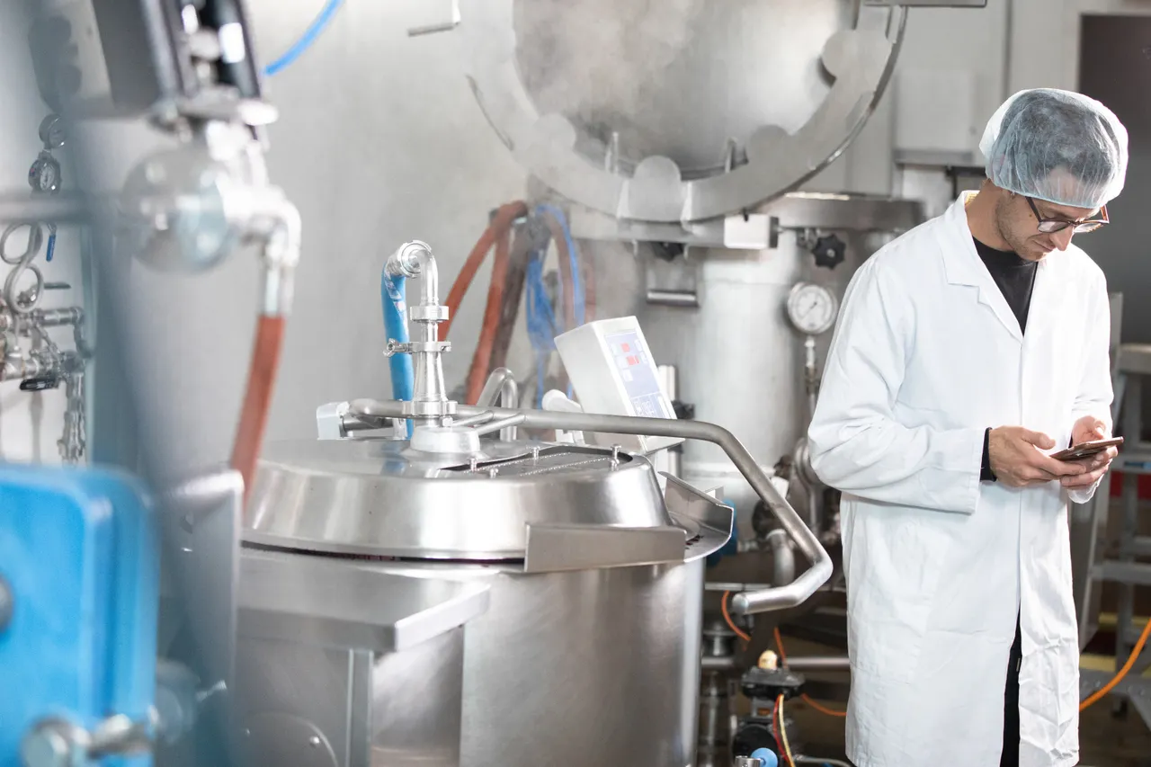 Man in laboratory working on phone