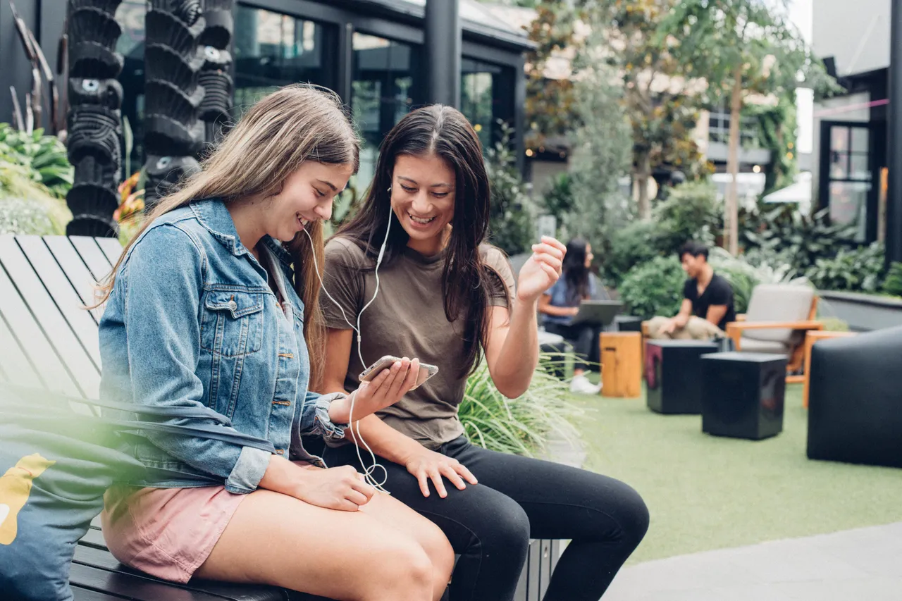 Two girls looking at phone