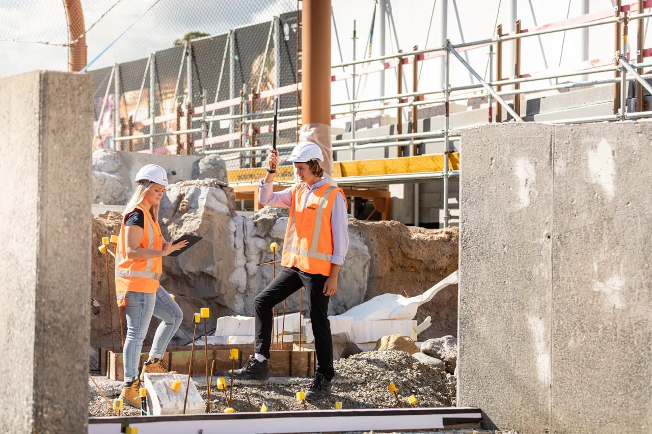 Man and woman on building site