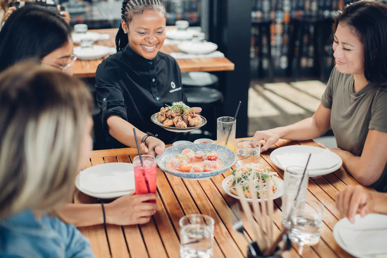 Girls being served a beautiful meal